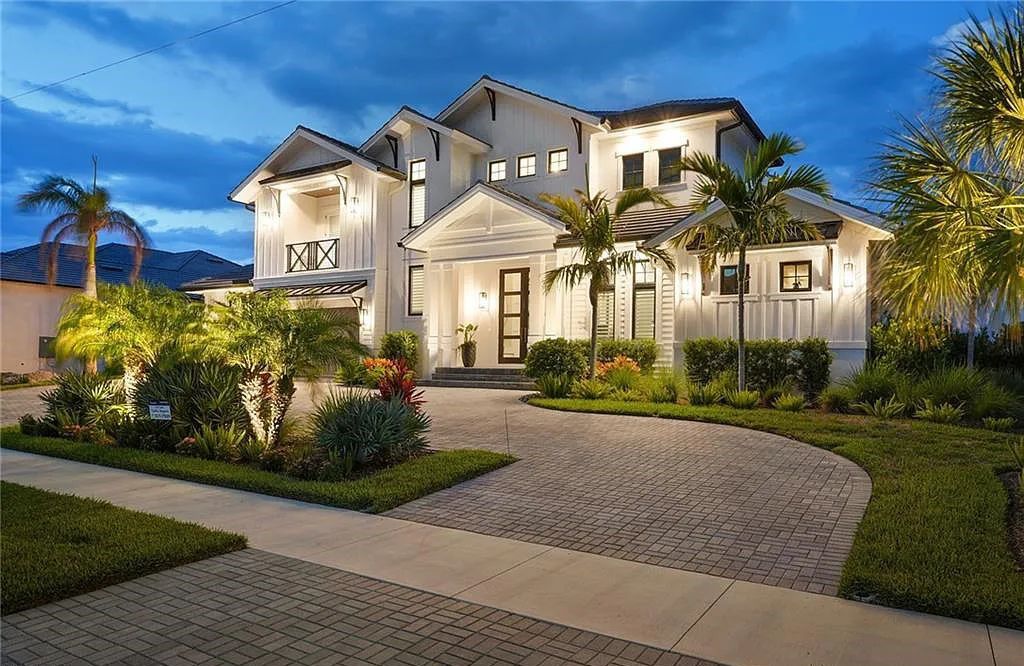 Experience the epitome of waterfront luxury at 541 Hammock Ct, Marco Island, Florida. Built in 2020 in the prestigious Coastal Contemporary Estates area, this home boasts grandeur with a 30-foot foyer ceiling and breathtaking water views.