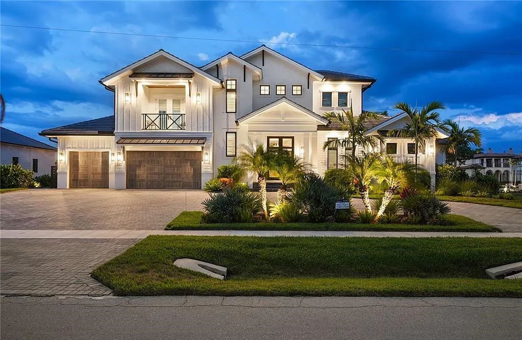 Experience the epitome of waterfront luxury at 541 Hammock Ct, Marco Island, Florida. Built in 2020 in the prestigious Coastal Contemporary Estates area, this home boasts grandeur with a 30-foot foyer ceiling and breathtaking water views.