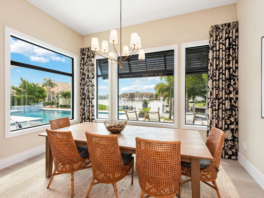 Discover waterfront perfection at 681 Crescent St, Marco Island, FL. This 2020-built, lightly lived-in masterpiece offers 4 bedrooms, 5 baths, and 4,047 square feet of luxury living. Its open split floor plan seamlessly blends indoor and outdoor spaces, revealing breathtaking bay views.