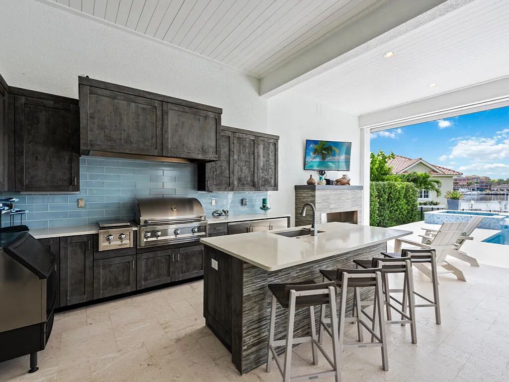 Discover waterfront perfection at 681 Crescent St, Marco Island, FL. This 2020-built, lightly lived-in masterpiece offers 4 bedrooms, 5 baths, and 4,047 square feet of luxury living. Its open split floor plan seamlessly blends indoor and outdoor spaces, revealing breathtaking bay views.