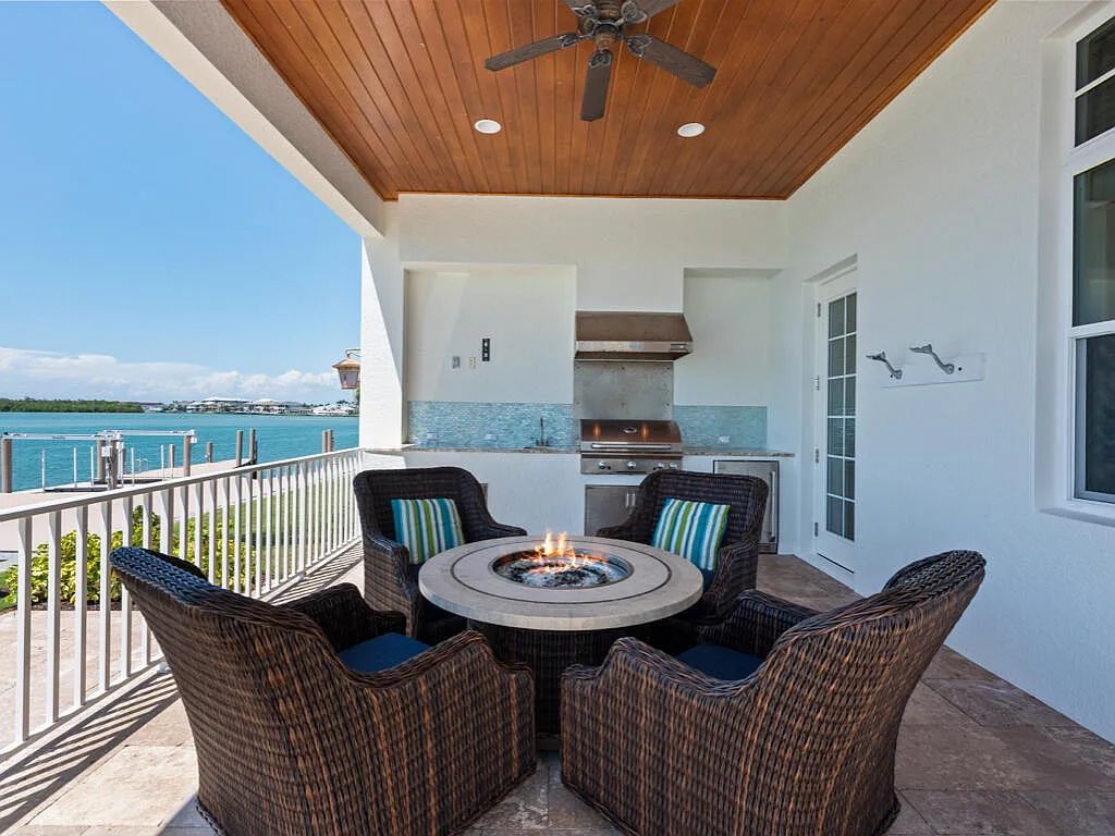 Nestled in prestigious Collier Bay on Marco Island, 960 Giralda Ct embodies coastal luxury living at its finest. With unobstructed bay views, this 2014-built, 4-bedroom, 5-bathroom home seamlessly combines opulence and coastal chic style.