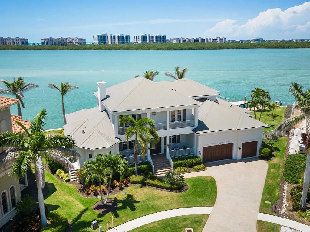 Nestled in prestigious Collier Bay on Marco Island, 960 Giralda Ct embodies coastal luxury living at its finest. With unobstructed bay views, this 2014-built, 4-bedroom, 5-bathroom home seamlessly combines opulence and coastal chic style.