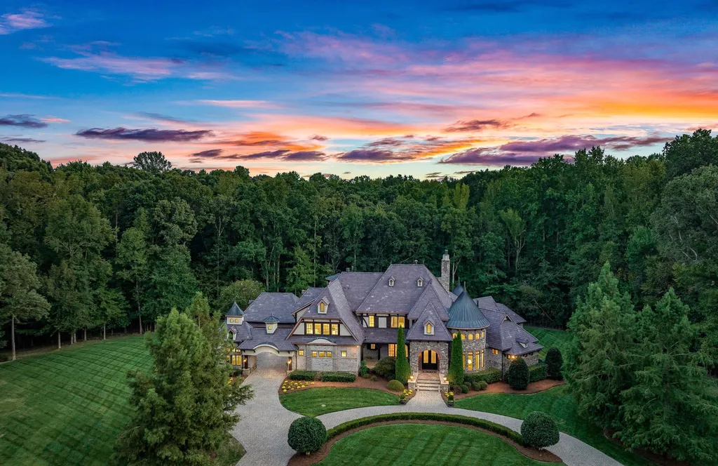 1007 Eirlys Lane Home in Matthews, North Carolina. Discover privacy and opulence at 1007 Eirlys Lane, a 6-bedroom, 6.5-bath, 9,414-square-foot estate on over 3 gated acres. This masonry masterpiece offers a family-focused design, with a downstairs suite ideal for in-house caregiving, private living quarters, elevator access, and amenities like a pool, hot tub, gym, and theater. 