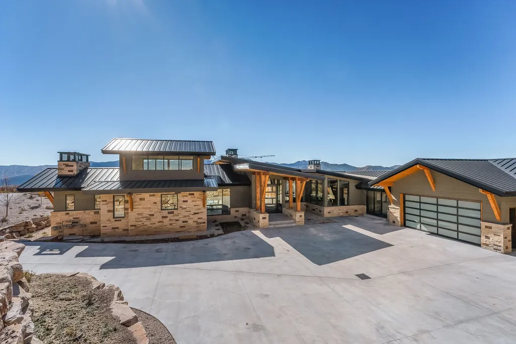 2409 Preserve Drive Home in Park City, Utah. Discover this stunning 6-bedroom, 8-bathroom, 9,196 sq. ft. contemporary home in The Preserve, a premier gated community. Perched on 9.07 acres at the mountain's summit, the home offers breathtaking 280-degree views of ski areas, the Olympic Park, and Salt Lake City.