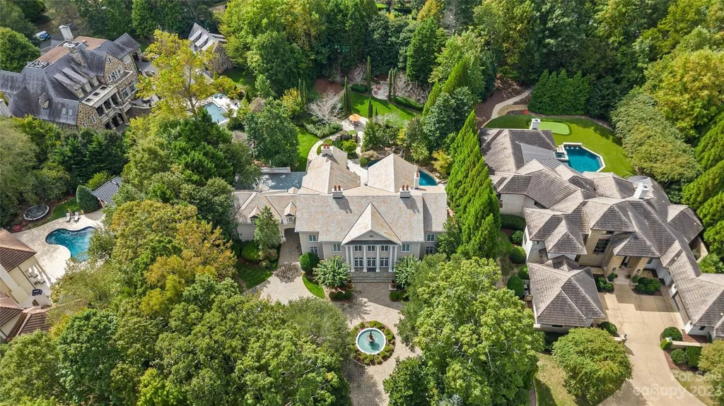 4424 Fox Brook Lane Home in Charlotte, North Carolina. Experience opulent living in this one-of-a-kind 6-bedroom estate in the exclusive gated community of Morrocroft Estates. With 9,149 sq ft, 8 bathrooms, and exquisite details throughout, this home offers grandeur and sophistication.