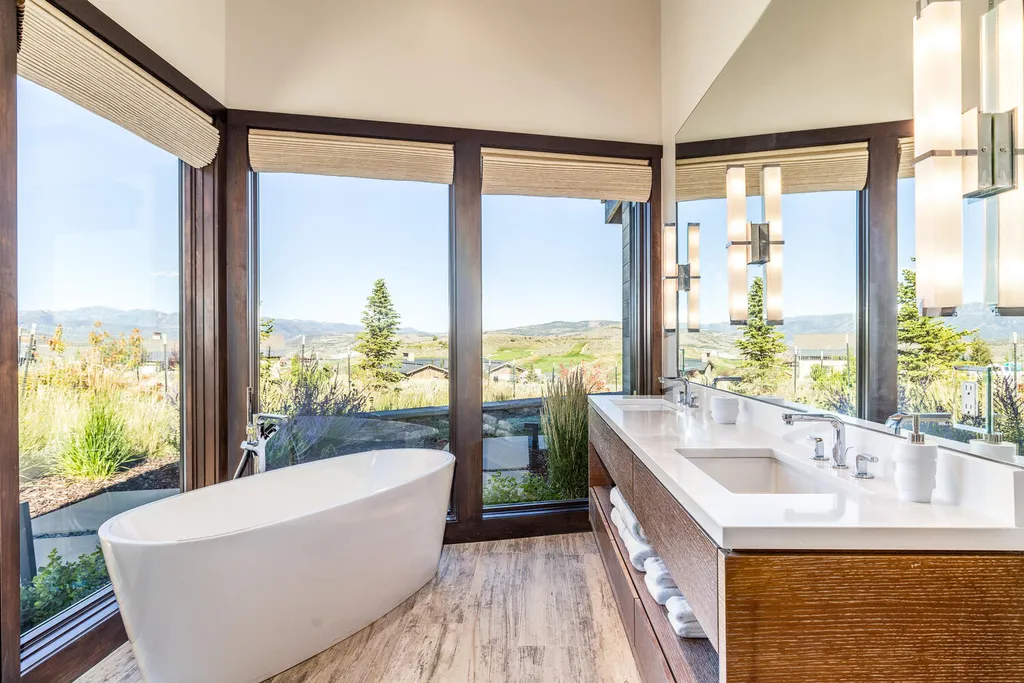 7235 North Starlight Circle Home in Kamas, Utah. Experience ultimate luxury living in this exceptional 5-bedroom, 5 ½-bathroom masterpiece spanning 6,270 square feet. Embrace the outdoors with folding glass doors leading to a heated patio, infinity spa pool, and landscaped yard with stunning Deer Valley and Jordanelle Reservoir views.