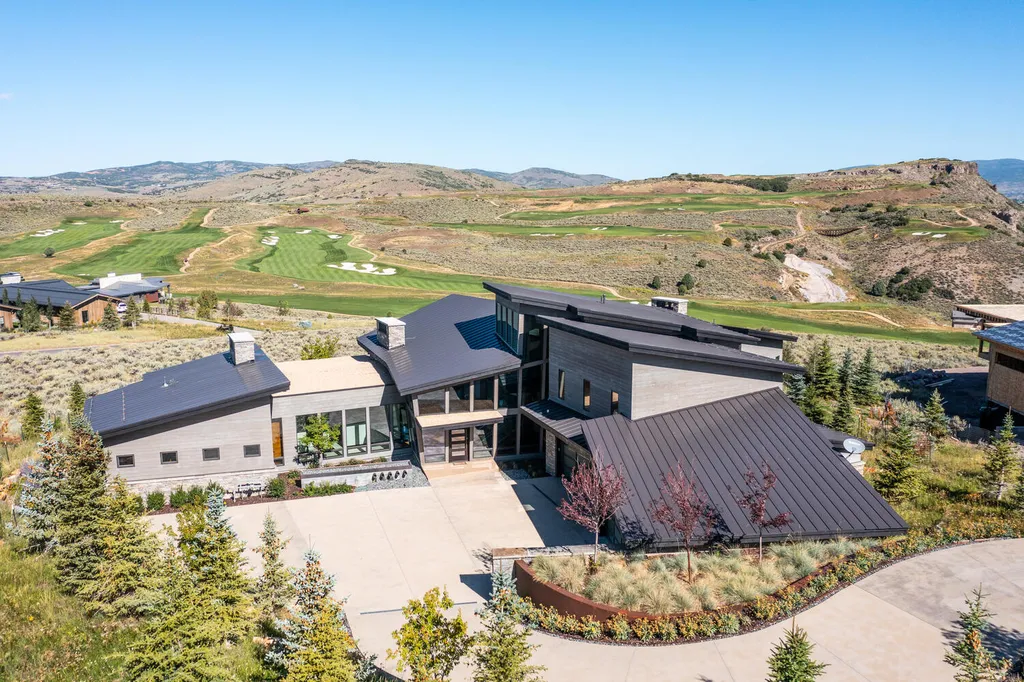 7235 North Starlight Circle Home in Kamas, Utah. Experience ultimate luxury living in this exceptional 5-bedroom, 5 ½-bathroom masterpiece spanning 6,270 square feet. Embrace the outdoors with folding glass doors leading to a heated patio, infinity spa pool, and landscaped yard with stunning Deer Valley and Jordanelle Reservoir views.