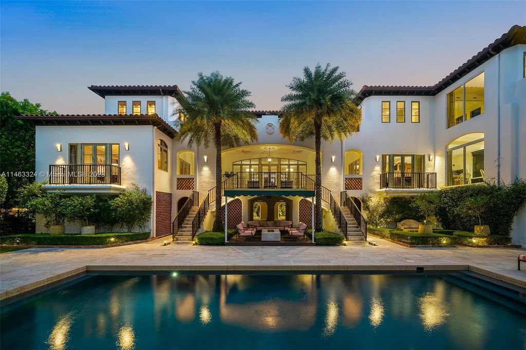 Nestled in Miami's exclusive Coconut Grove enclave within the private guard-gated community of “The Moorings,” this expansive 7-bedroom, 9-bathroom waterfront estate at 3305 S Moorings Way offers 14,720 square feet of meticulously crafted living space.