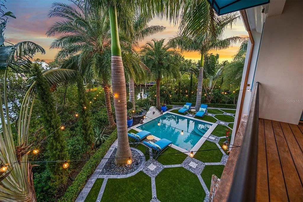 Discover the epitome of luxury living on Anna Maria Island with this meticulously crafted Villa Rosa Way residence. Inspired by the elegance of Europe's 18th Century Romantic Era, this 4-bed, 6-bath property offers an opulent experience at every turn.