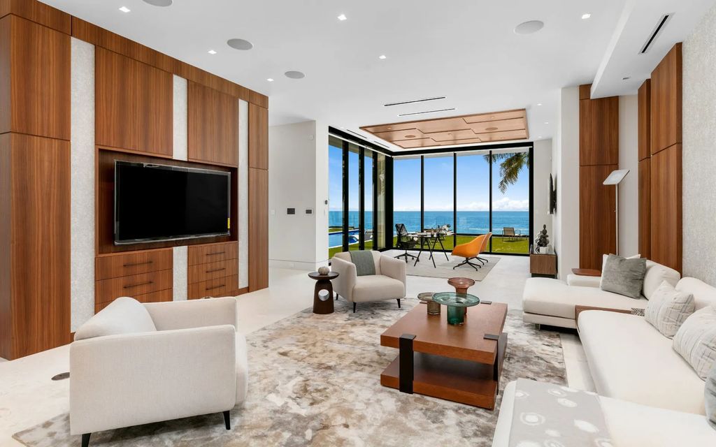 Discover the epitome of luxury living at 3052 N Atlantic Blvd, a newly constructed 12,667-square-foot beachfront masterpiece in Fort Lauderdale, Florida. Crafted by Bomar Builders, this paradise offers 100 feet of pristine ocean frontage, a grand entertaining level with a soaring great room and chef's kitchen, guest suites on the third floor with an AM bar, and a primary suite that opens onto an alluring ocean-view balcony.