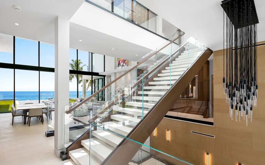 Discover the epitome of luxury living at 3052 N Atlantic Blvd, a newly constructed 12,667-square-foot beachfront masterpiece in Fort Lauderdale, Florida. Crafted by Bomar Builders, this paradise offers 100 feet of pristine ocean frontage, a grand entertaining level with a soaring great room and chef's kitchen, guest suites on the third floor with an AM bar, and a primary suite that opens onto an alluring ocean-view balcony.
