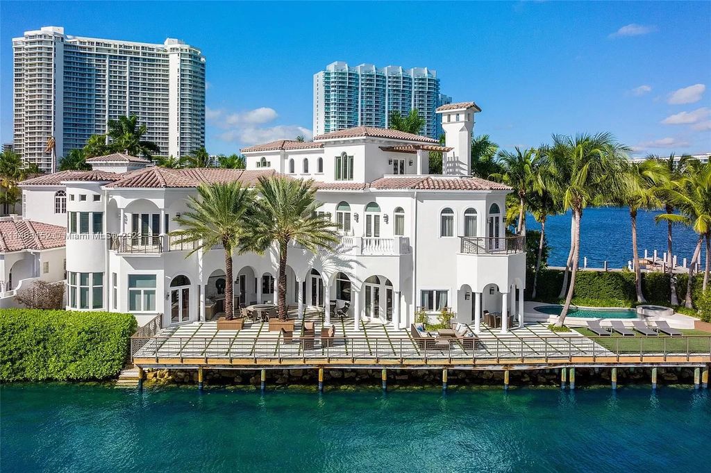 Discover the pinnacle of island living at 4042 Island Estates Dr, Aventura, FL. This impressive 3-level sanctuary, crafted in 2001, presents 5 bedrooms with private waterfront balconies, 6 bathrooms, and 2 half baths within its 7,796 square feet.