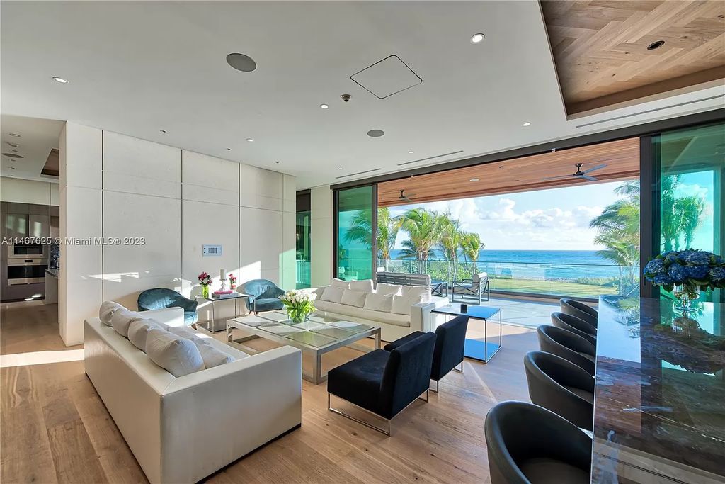Discover the ultimate oceanfront luxury at 263 Ocean Blvd, Golden Beach, FL. This breathtaking 3-story, 9-bedroom, 13-bathroom mansion offers 11,880 square feet of meticulously designed living space, with a 20,925 square foot lot boasting 75 feet of pristine beachfront.