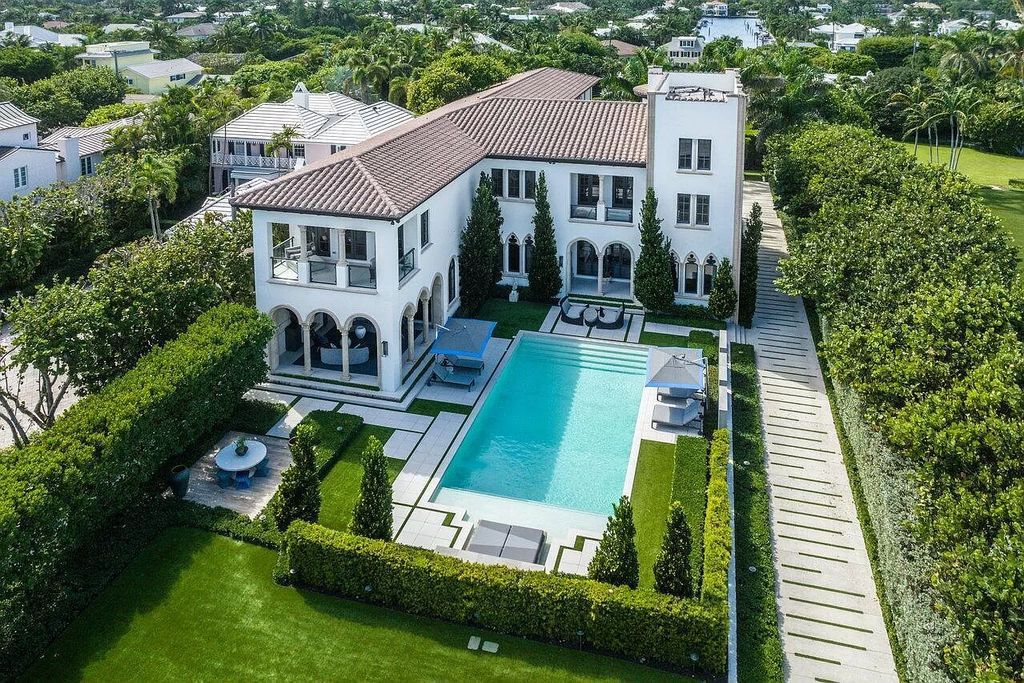 Discover an exquisite 7-bedroom, 9-bathroom haven at 410 N Ocean Blvd, Delray Beach, FL 33483, boasting 10,385 square feet of meticulously designed luxury by renowned architect Jeff Strasser. Every corner reflects a commitment to unparalleled craftsmanship, with lavish finishes and handpicked appointments that speak to the substantial investment poured into this masterpiece.