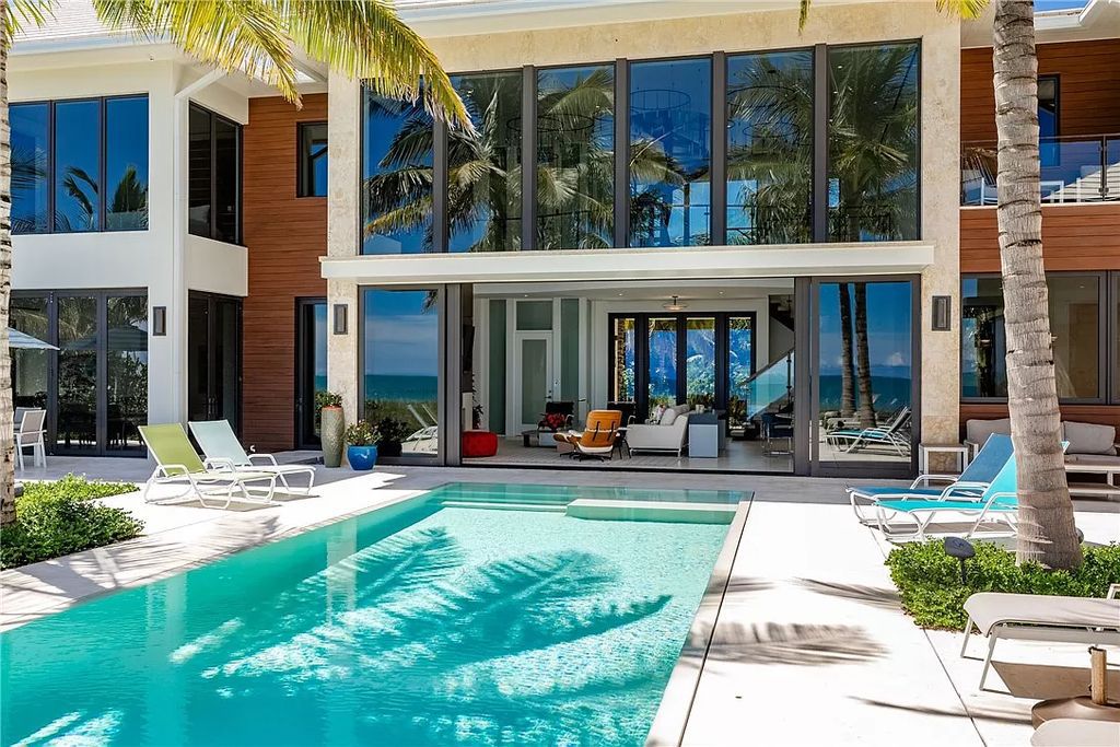 This modern oceanfront estate, located at 6600 N Highway A1a, Hutchinson Island, Florida, spans 1.5 acres and offers unparalleled privacy. With 149 glass windows and doors, it seamlessly blends stone, wood, and glass, creating a masterpiece of luxury and tranquility.