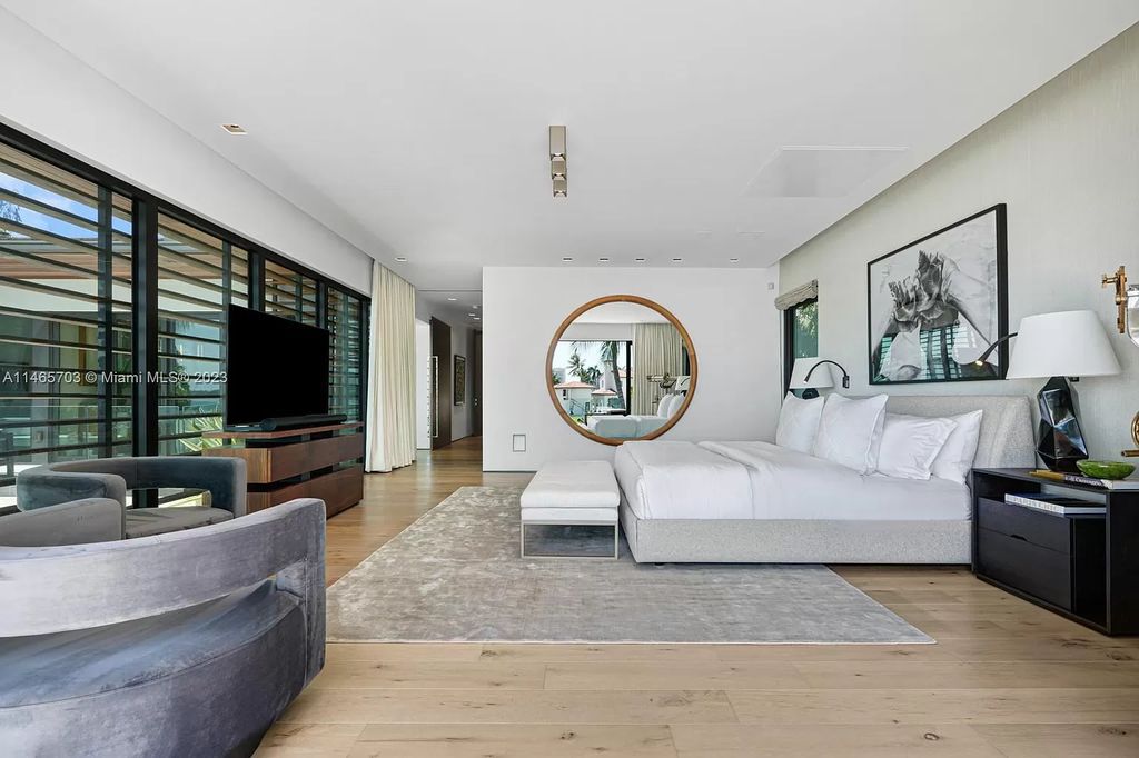 Welcome to Villa Aman, a luxurious modern masterpiece located at 1826 W 23rd St, Miami Beach, FL. Crafted by Cesar Molina, this bespoke property features 7 suites, including a guest pavilion, complemented by a fireplace room, elegant dining with a wine cellar, and an office overlooking a serene koi pond.