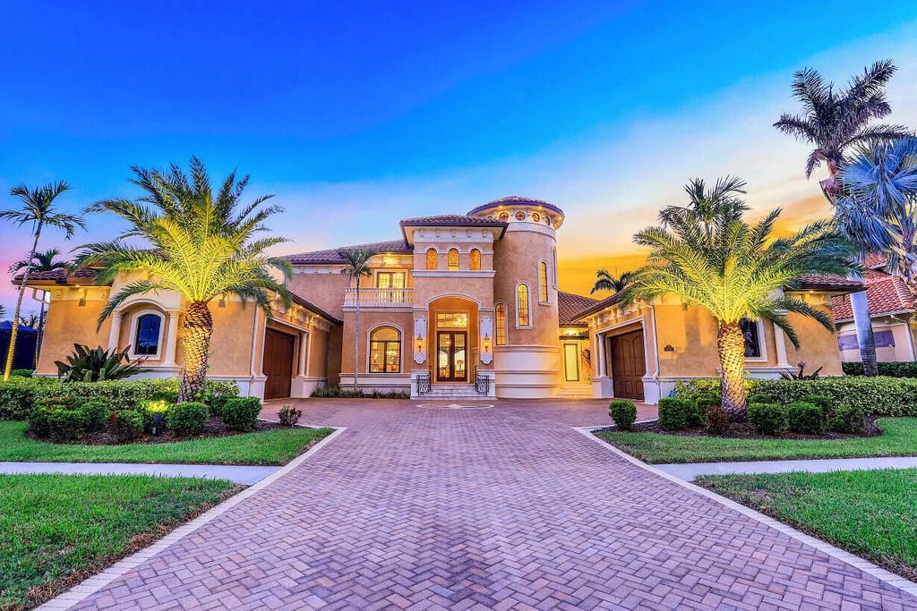 Indulge in luxury waterfront living at 590 S Heathwood Dr, Marco Island, FL 34145, with nightly sunset views. This 5-bedroom, 7-bath custom-built bayfront residence features a grand 2-story cupola foyer, open living areas with a statement fireplace, gourmet Chef's kitchen, and an opulent ground level primary suite wing.