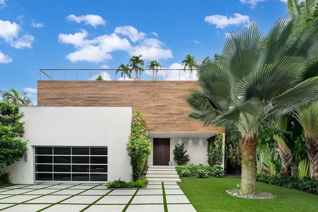 Discover the pinnacle of Miami Beach luxury living at 1142 N Venetian Dr, FL 33139. This 6-bedroom, 6-bath residence spans 6,685 sqft, boasting a seamless blend of contemporary design and comfort. Nestled on the soon-to-be exclusive gated section of the Venetian Islands, this home offers a louvered dining area, media lounge, suede-paneled living salon, and an expansive teak kitchen with Miele & SubZero appliances.