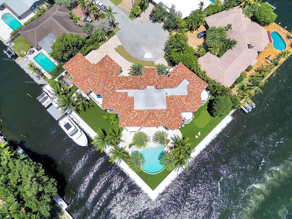 Welcome to 3080 NE 41st St, Fort Lauderdale, FL, a luxurious 6-bedroom, 9-bathroom estate built in 2019. This exceptional property boasts 190 feet of side dockage and 140 feet on the Intracoastal Waterway, making it a boater's paradise and an entertainer's dream with an outdoor speaker system.
