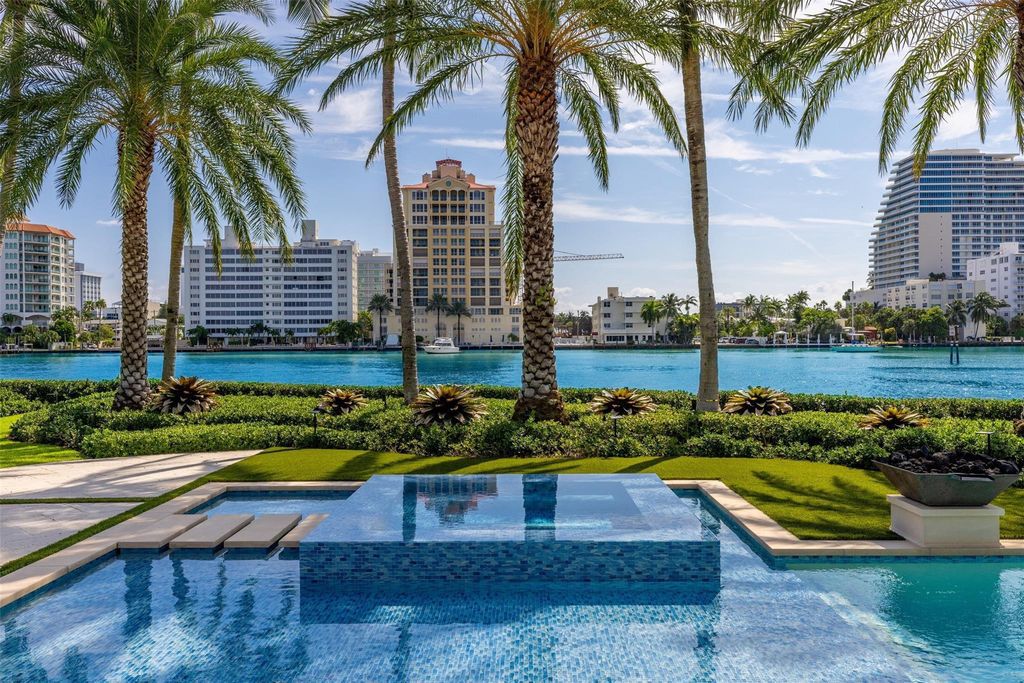 Discover the epitome of luxury waterfront living in this exceptional 6-bedroom, 8-bathroom estate at 2724 Sea Island Dr, Fort Lauderdale. Located in the prestigious Seven Isles neighborhood, this half-acre double lot showcases two pools, covered outdoor spaces, and 325 feet of southeast-exposure waterfront.
