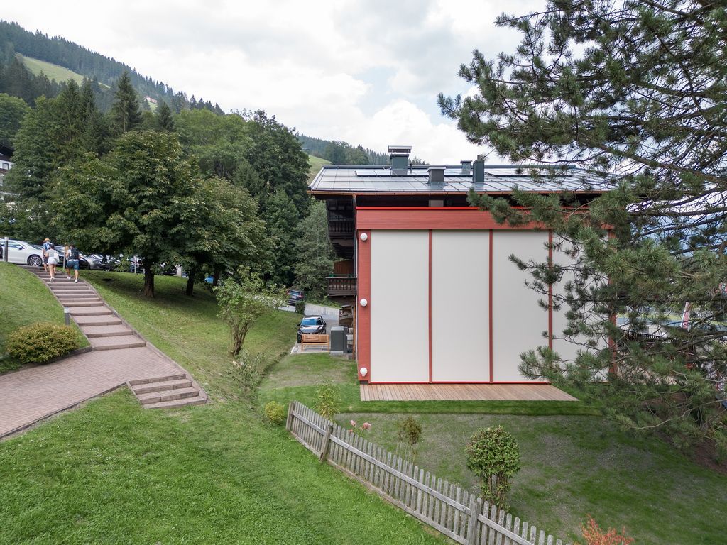 House Schmitten, A Vibrantly Red Alpine Chalet by Steiner Architecture