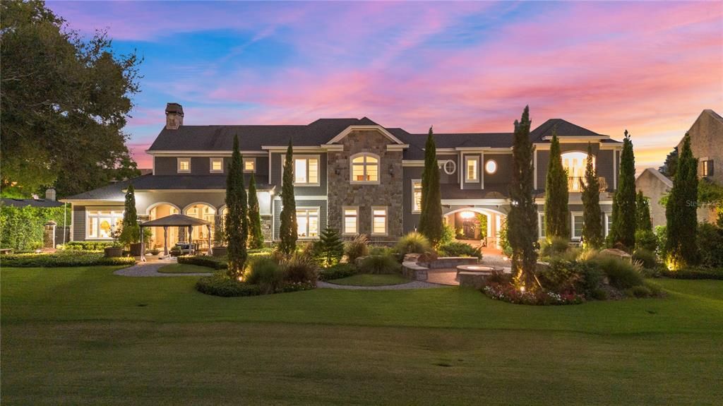 This extraordinary 2018 custom estate, nestled along Tampa's Palma Ceia Golf Course, combines masterful craftsmanship, cutting-edge technology, and lush landscapes. With 6 bedrooms, 8 bathrooms, and 7,872 square feet of living space on a 0.55-acre lot, this home offers grandeur without sacrificing comfort.