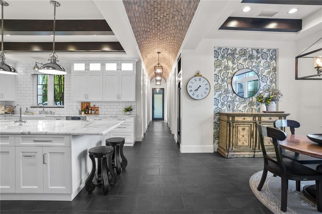 This extraordinary 2018 custom estate, nestled along Tampa's Palma Ceia Golf Course, combines masterful craftsmanship, cutting-edge technology, and lush landscapes. With 6 bedrooms, 8 bathrooms, and 7,872 square feet of living space on a 0.55-acre lot, this home offers grandeur without sacrificing comfort.