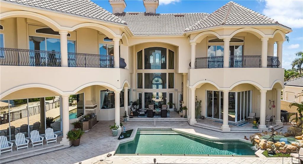 Discover an extraordinary waterfront estate at 11250 Longwater Chase Ct, Fort Myers, Florida. This opulent home, crafted by HARBOURSIDE CUSTOM HOMES, offers an unparalleled lifestyle in Gulf Harbour Yacht & Country Club.