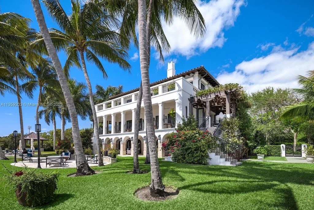 Exuding sophistication and luxury, this 8-bed, 9-bath, 10,099-square-foot, 3-story Villa at 3080 Munroe Dr, Miami, Florida offers stunning bayfront living. The 30-foot ceiling atrium and Jerusalem stone staircase reveal breathtaking panoramic views of the Miami skyline, while the 40-foot dock and meticulously crafted mahogany floors exemplify the attention to detail.