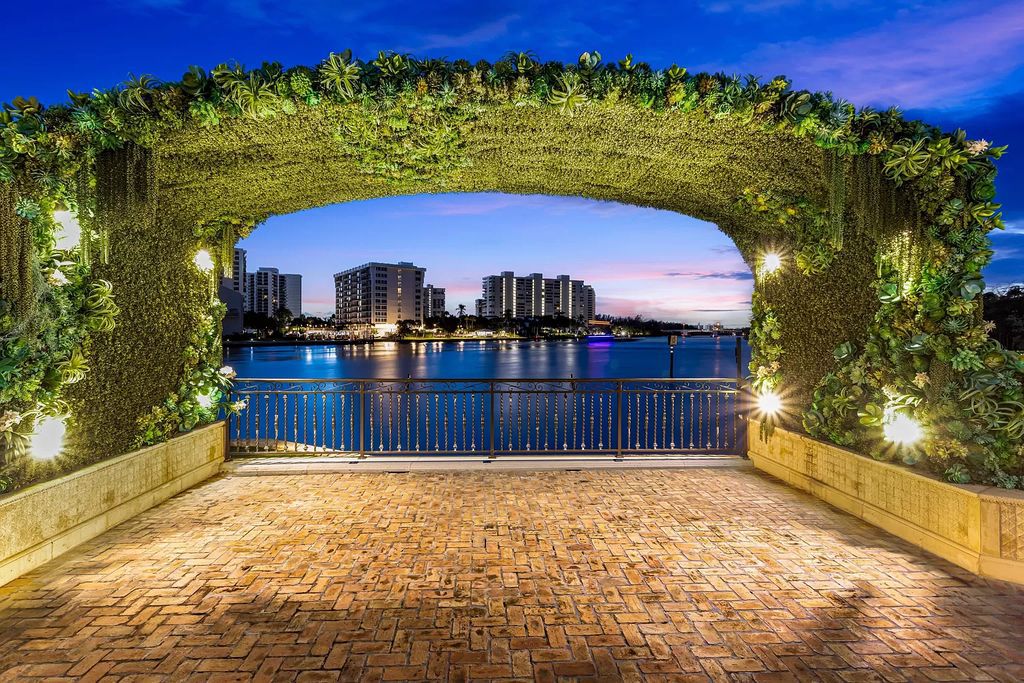 Nestled on a prime 1.06-acre waterfront estate at 5001 Egret Point Circle, Boca Raton, this Italianate marvel in The Sanctuary presents 8 bedrooms, 14 baths, and 14,848 square feet of opulent living space, meticulously crafted in 2005.
