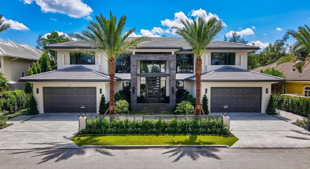 Experience the epitome of luxury living at this brand new contemporary waterfront masterpiece in Boca Raton's prestigious Royal Palm Yacht & Country Club. Spanning 9,030 square feet with 6 bedrooms and 9 baths, this turnkey estate by Albanese & Sons, BE Designs, and Zelman Design offers a 2-story lit foyer, a lavish living room with serene Capone Island views, a dream chef's kitchen with top-tier appliances, a resort-style pool and spa, and smart house technology.