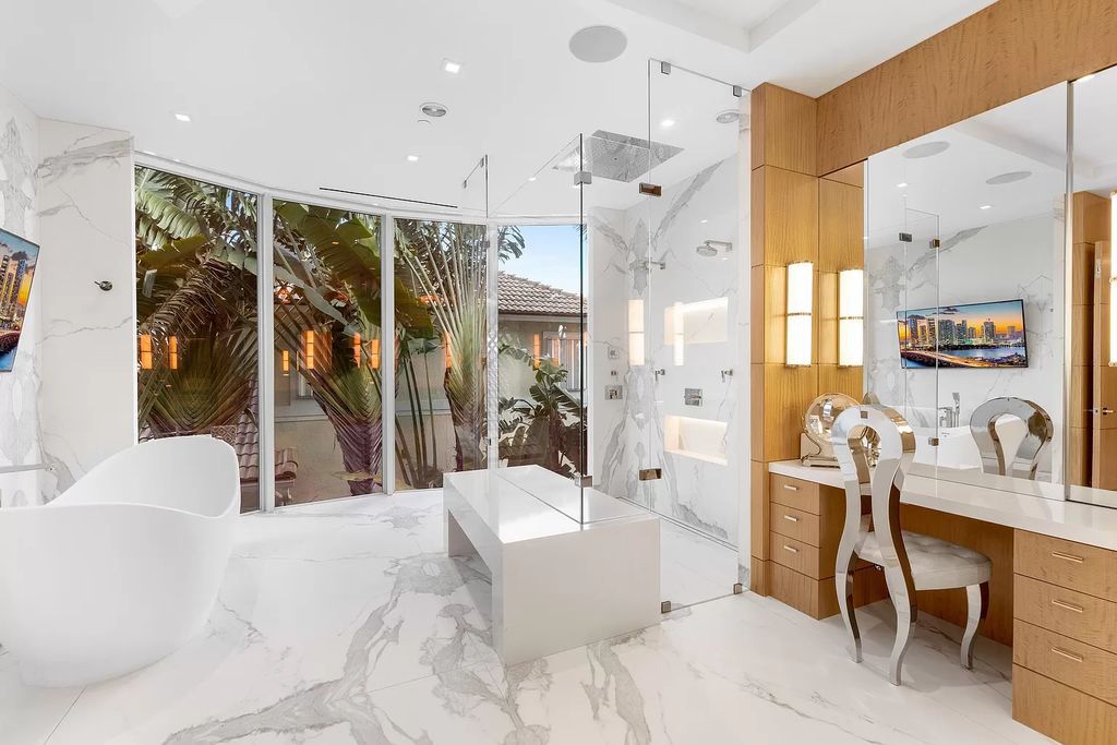 Discover The Isla Bahia Estate, an architectural marvel in Fort Lauderdale's Harbour Beach. With 6 bedrooms, 11 baths, and over 10,800 square feet, this 2018-built waterfront mansion offers unparalleled luxury, boasting a gourmet kitchen, a theater, and an elevator.