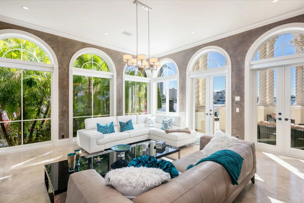 Discover the pinnacle of luxury living at 2 Pelican Dr, a gated point lot estate in Fort Lauderdale's Las Olas community. This stunning 5-bedroom, 8-bathroom home, with over 10,000 square feet of living space, showcases extensive upgrades, marble flooring, a smart-home system, elevator, and a whole-house generator.