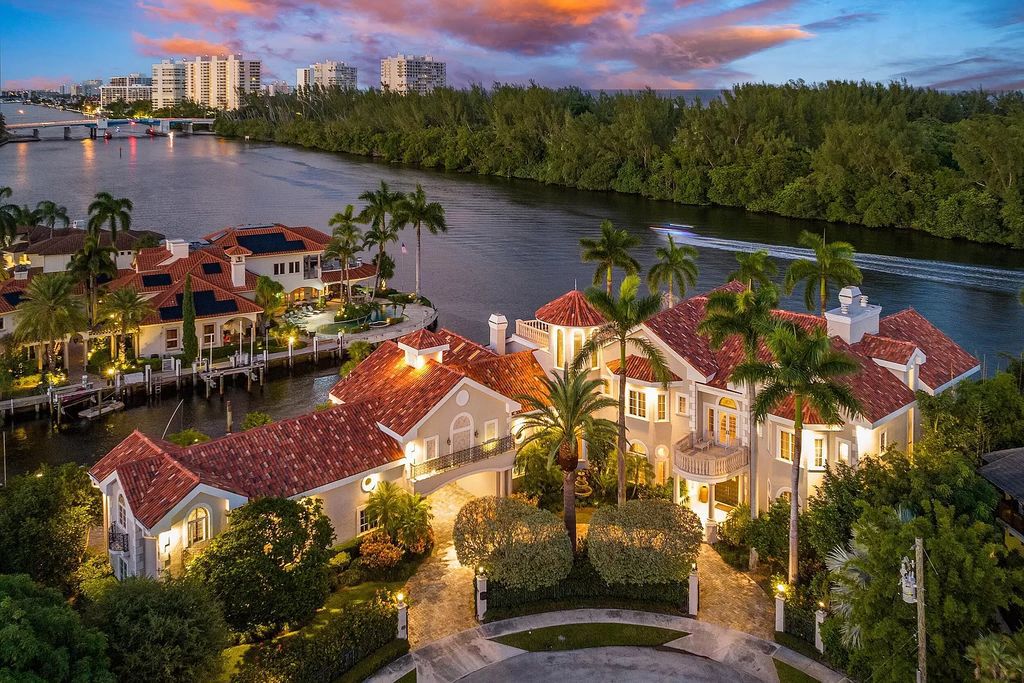 Discover Villa Bellevue, an extraordinary 8-bedroom, 10-bathroom waterfront estate in Boca Raton's esteemed Lake Rogers Isle. This European-inspired masterpiece, spanning 12,340 square feet of living space and situated on a 0.74-acre lot, exudes timeless elegance with its soaring ceilings, robust concrete construction, and 369 feet of deep-water intracoastal and protected canal frontage.