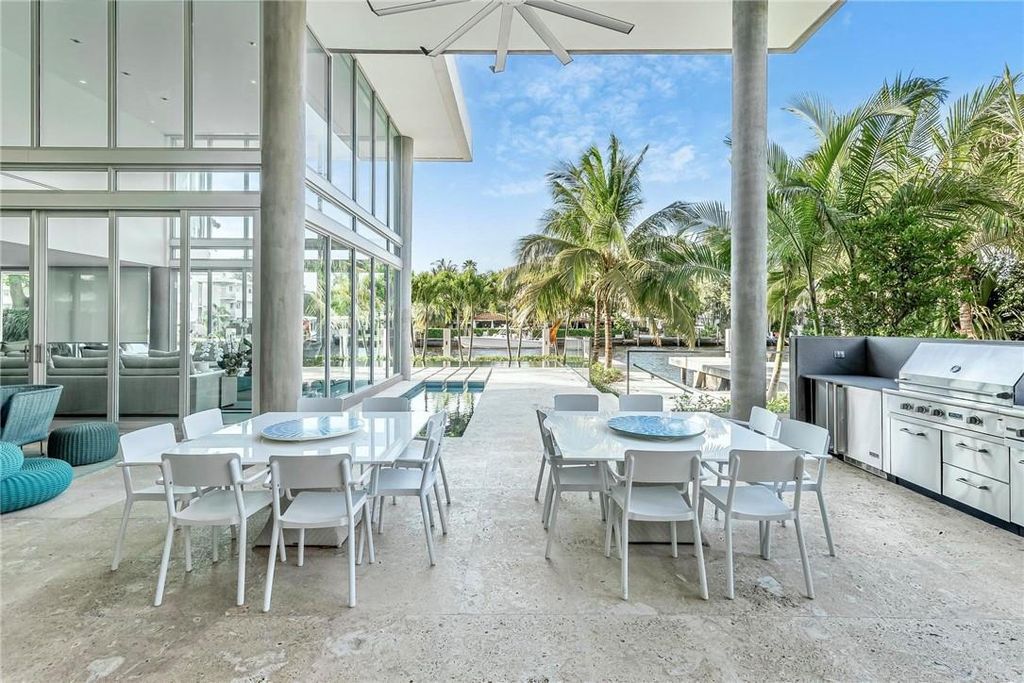 Discover an exquisite waterfront masterpiece along Fort Lauderdale's prestigious Rio Vista Boulevard. This modern marvel boasts 120 feet of New River frontage on a sprawling estate, where panoramic river views and lush tropical gardens merge seamlessly.