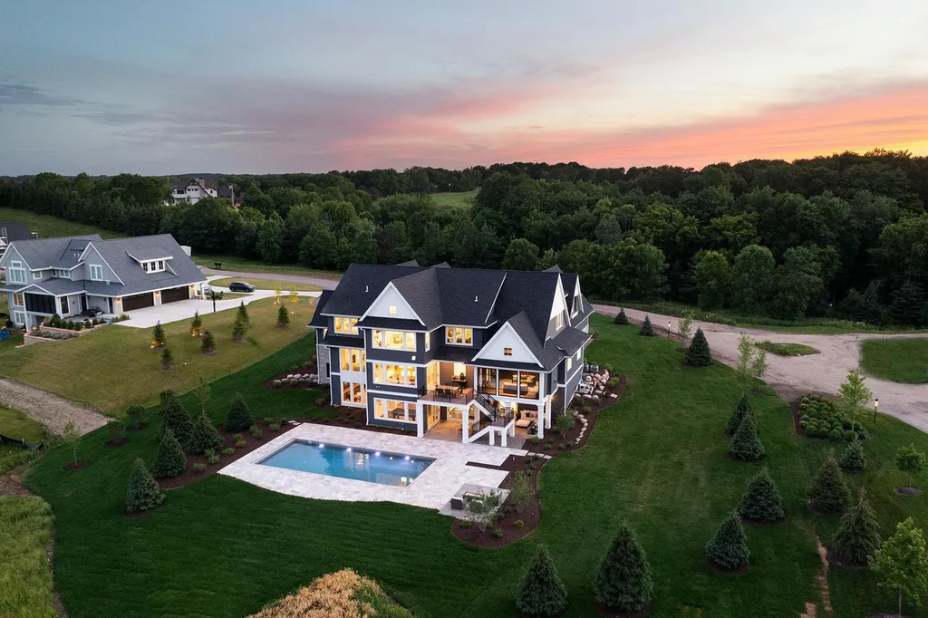 165X Shadywood Road Home in Wayzata, Minnesota. Embrace lakeside luxury with a custom-built home by Wooddale Builders on Crystal Bay, Lake Minnetonka. This east-facing masterpiece offers panoramic views, 118 ft of lakeshore, and an open concept design. 