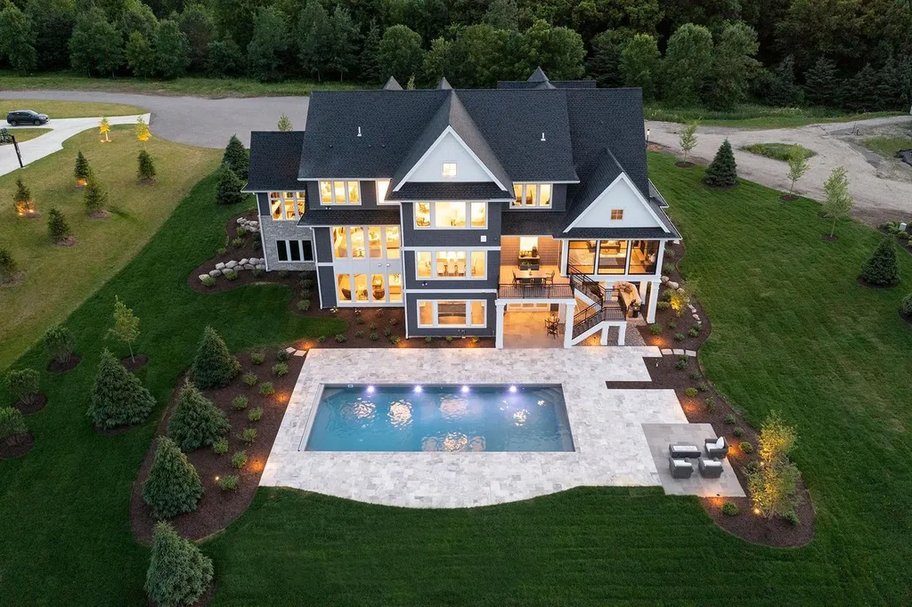 165X Shadywood Road Home in Wayzata, Minnesota. Embrace lakeside luxury with a custom-built home by Wooddale Builders on Crystal Bay, Lake Minnetonka. This east-facing masterpiece offers panoramic views, 118 ft of lakeshore, and an open concept design. 