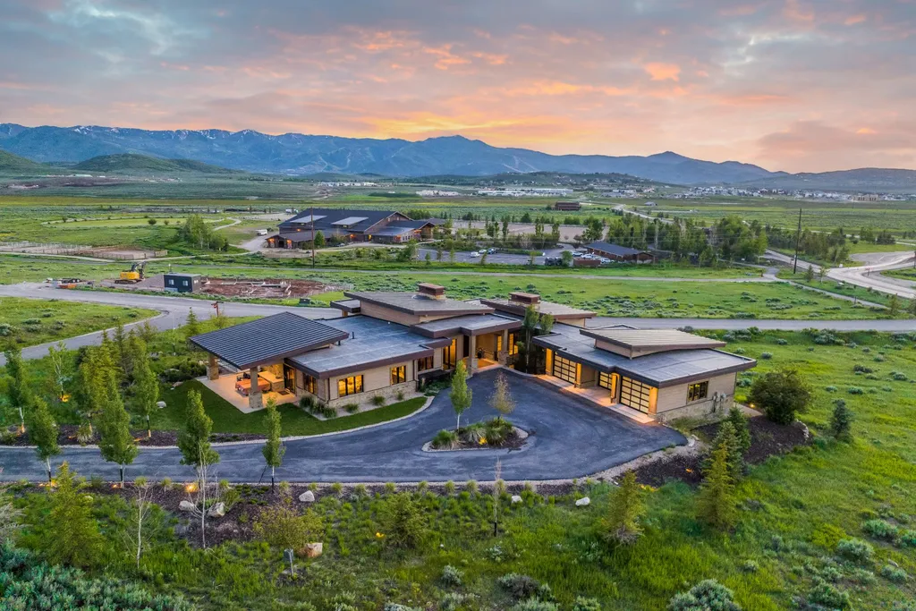 2481 Prairie Schooner Trail LOT 16 Home in Park City, Utah. Discover this exquisite Scandinavian custom-built "green home" in Promontory, offering easy access, stunning views, and a golf membership. With a thoughtfully designed interior and turnkey furnishings, this multi-generational family estate provides an ideal setting for an active lifestyle.