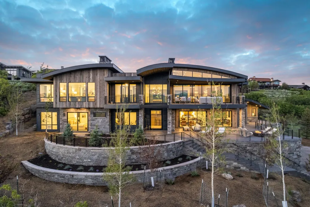 2687 East Canyon Gate Road Home in Park City, Utah. Immerse yourself in the pinnacle of luxury living with this James L. Carroll-designed estate in Promontory Ridge, Park City. Boasting over 8,600 sq ft of opulent space, panoramic mountain views, and exquisite finishes, this property is a true architectural masterpiece.