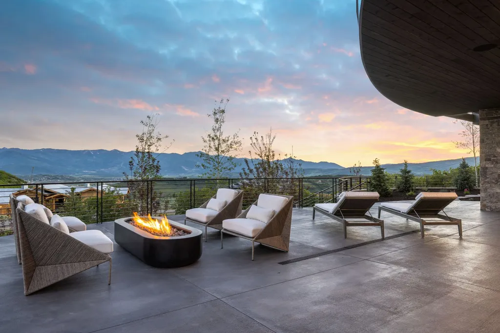 2687 East Canyon Gate Road Home in Park City, Utah. Immerse yourself in the pinnacle of luxury living with this James L. Carroll-designed estate in Promontory Ridge, Park City. Boasting over 8,600 sq ft of opulent space, panoramic mountain views, and exquisite finishes, this property is a true architectural masterpiece.