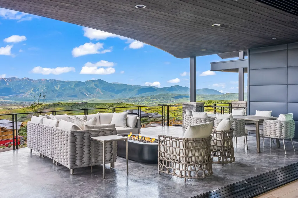 2687 East Canyon Gate Road Home in Park City, Utah. Immerse yourself in the pinnacle of luxury living with this James L. Carroll-designed estate in Promontory Ridge, Park City. Boasting over 8,600 sq ft of opulent space, panoramic mountain views, and exquisite finishes, this property is a true architectural masterpiece.