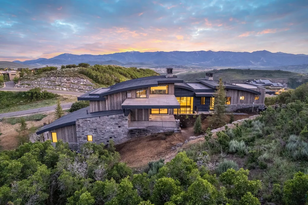 2687 East Canyon Gate Road Home in Park City, Utah. Immerse yourself in the pinnacle of luxury living with this James L. Carroll-designed estate in Promontory Ridge, Park City. Boasting over 8,600 sq ft of opulent space, panoramic mountain views, and exquisite finishes, this property is a true architectural masterpiece.