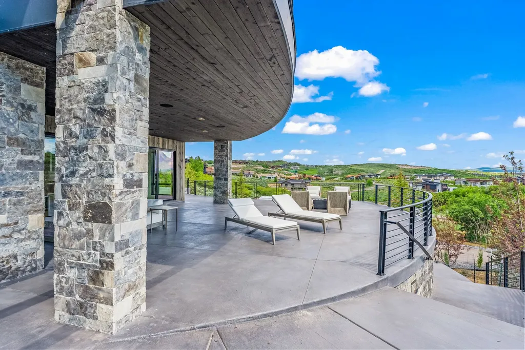 2687 East Canyon Gate Road Home in Park City, Utah. Immerse yourself in the pinnacle of luxury living with this James L. Carroll-designed estate in Promontory Ridge, Park City. Boasting over 8,600 sq ft of opulent space, panoramic mountain views, and exquisite finishes, this property is a true architectural masterpiece.