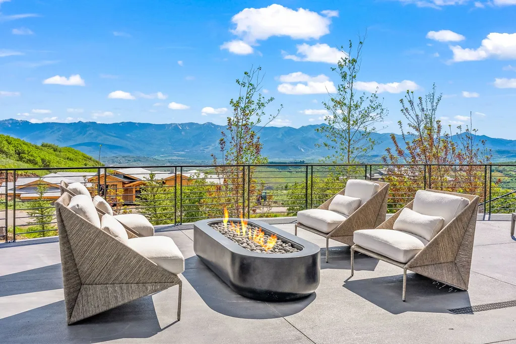 2687 East Canyon Gate Road Home in Park City, Utah. Immerse yourself in the pinnacle of luxury living with this James L. Carroll-designed estate in Promontory Ridge, Park City. Boasting over 8,600 sq ft of opulent space, panoramic mountain views, and exquisite finishes, this property is a true architectural masterpiece.