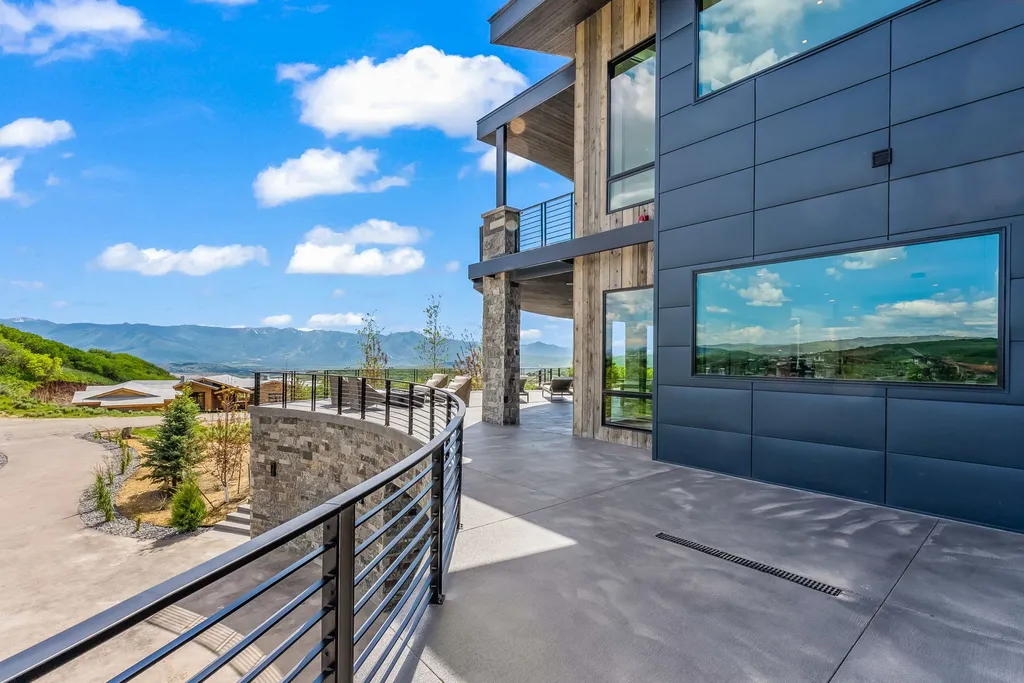 2687 East Canyon Gate Road Home in Park City, Utah. Immerse yourself in the pinnacle of luxury living with this James L. Carroll-designed estate in Promontory Ridge, Park City. Boasting over 8,600 sq ft of opulent space, panoramic mountain views, and exquisite finishes, this property is a true architectural masterpiece.