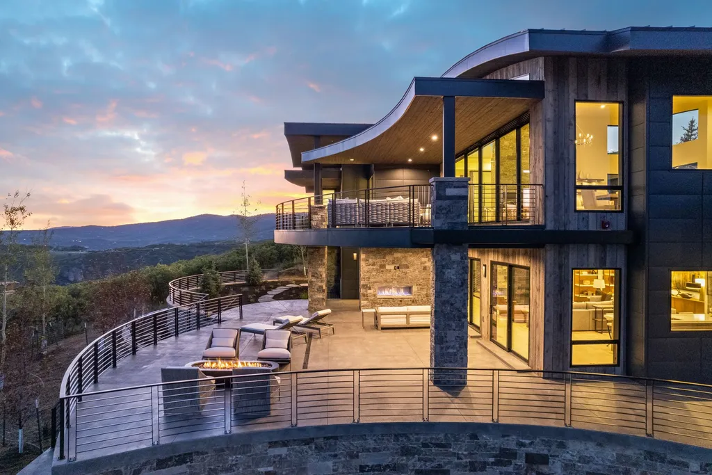 2687 East Canyon Gate Road Home in Park City, Utah. Immerse yourself in the pinnacle of luxury living with this James L. Carroll-designed estate in Promontory Ridge, Park City. Boasting over 8,600 sq ft of opulent space, panoramic mountain views, and exquisite finishes, this property is a true architectural masterpiece.