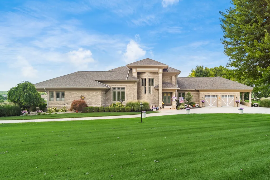 2902 Kilkenny Drive Home in Springfield, Ohio. Indulge in the epitome of luxury living with this gated, all-brick custom home nestled within the Windy Knoll Golf Course. Built in 1996, the residence offers opulent features, soaring ceilings, and an abundance of natural light.