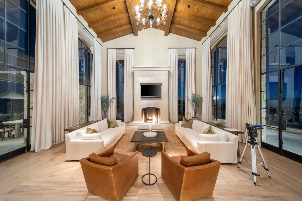 340 North Kanan Dume Road Home in Malibu, California. Perched atop a Malibu Canyon peak, the majestic Malibu Rocky Oaks is a stone-clad Tuscan villa offering unrivaled luxury and panoramic views. This 9,000-square-foot estate boasts 37 picturesque acres, a renowned vineyard, and endless world-class amenities. With a private helipad and infinity pool, this masterpiece redefines the essence of luxury living in the Malibu hills.