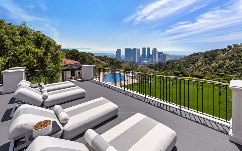 9904 Kip Drive Home in Beverly Hills, California. Enter the world of opulence and exclusivity with this celebrity compound behind gated privacy. Designed by KAA Associates, the 25,000 SF estate boasts 7 bedrooms, 13 bathrooms, lush gardens, and stunning canyon, city, and ocean views. 