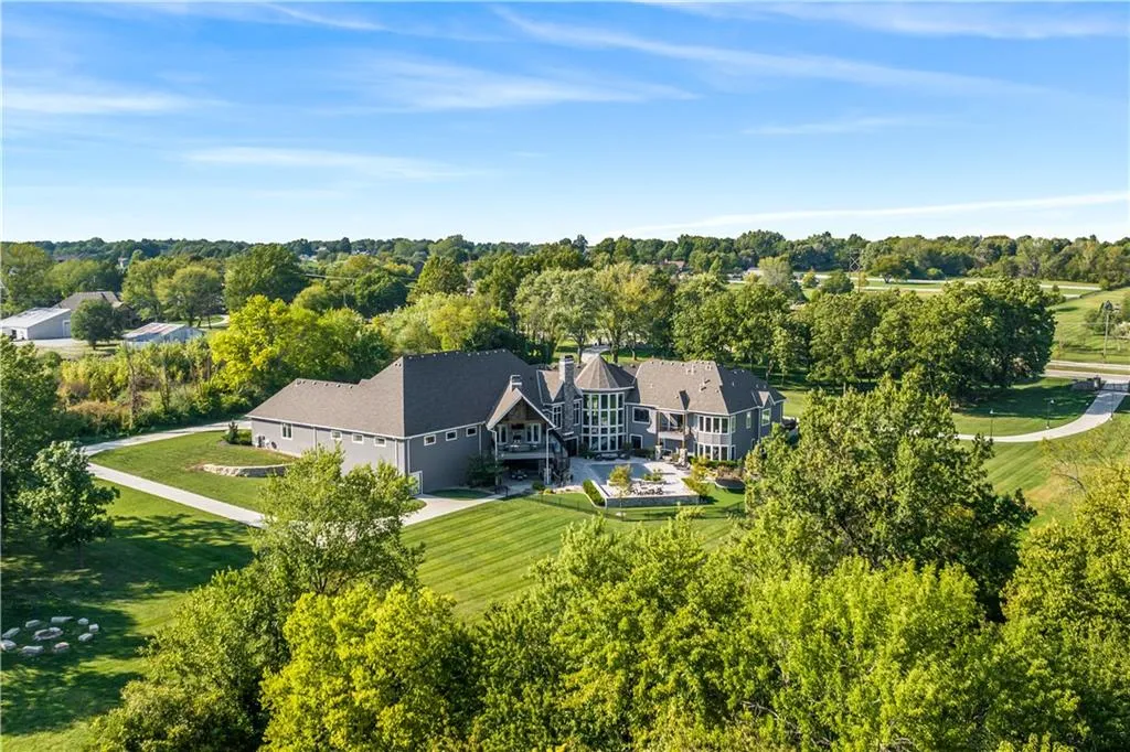 9925 West 159th Street Home in Overland Park, Kansas. Discover this modern masterpiece on 22+ private acres within the coveted Blue Valley School District. The STARR estate home, boasting nearly 14,000 sq ft of luxurious living space, features exceptional craftsmanship and high-quality materials. With 6 bedrooms, 9 bathrooms, a 6-car garage, and numerous unique amenities, this home is designed for the ultimate entertainer's dream.